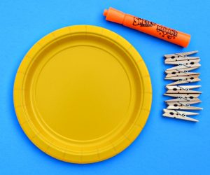 Just 3 items needed to make paper plate clothespin sun. 