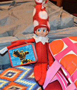 The Elf on the Shelf has his suitcase and is ready for the trip.