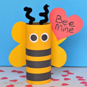 Turn your recycled paper rolls into a cute bee mine valentine day craft.