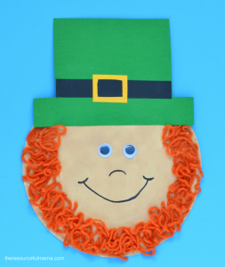 Paper plate leprechaun kid craft with a yarn beard for St. Patrick's Day