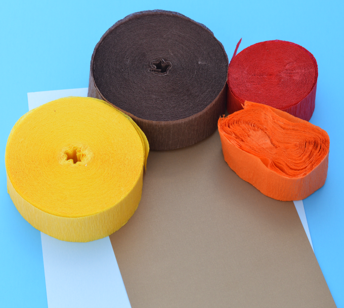 Kids explore texture and sound, develop fine motor skills, and have fun while making this easy crepe paper fall tree craft. leaves | preschool | kid craft