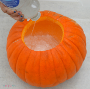 Kids will love watching as chemicals react and fizz over the sides of this pumpkin volcano, a fun and classic science experiment with a fall twist. Fall | Halloween | Pumpkins | Science | STEM