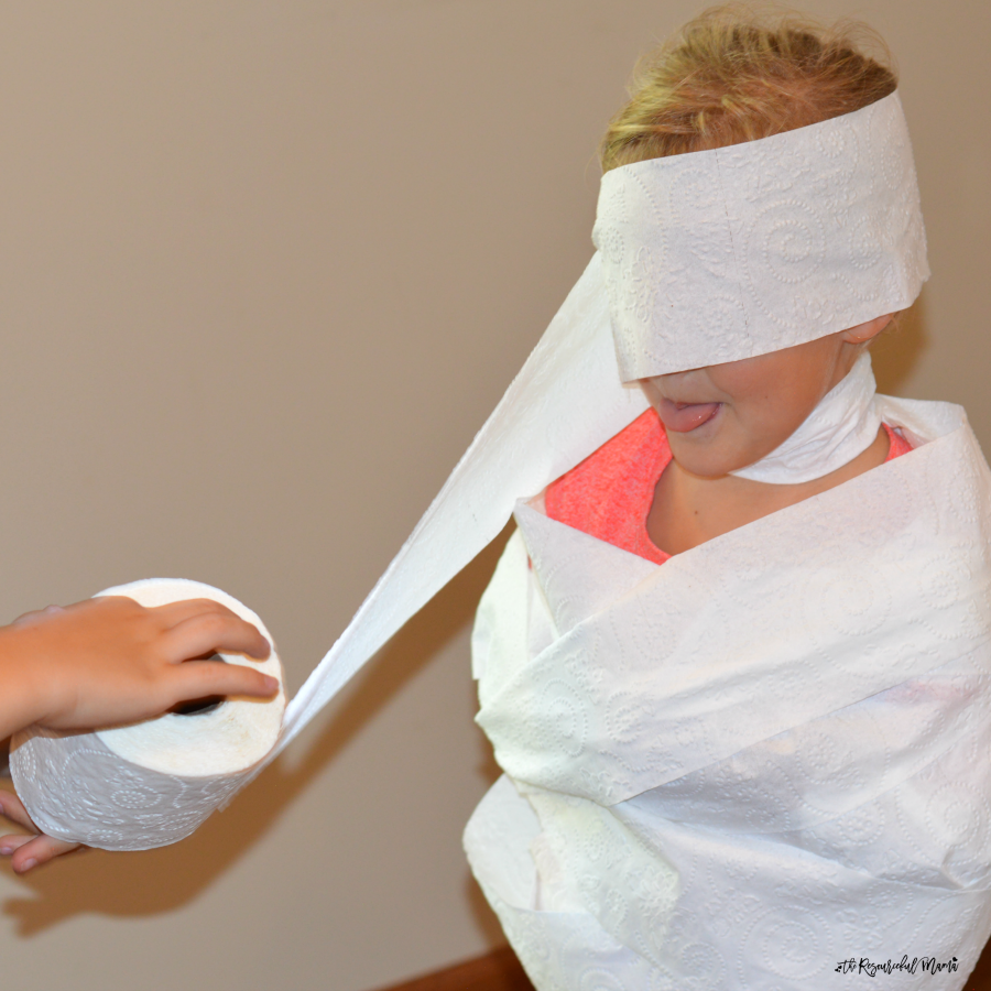 Kids will be giggling and shrieking with laughter as they play this wrap the mummy halloween game. It's an easy game to set up and play during school classroom parties.