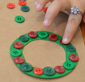 This Christmas wreath button ornament is a great ornament for kids to make for the Christmas tree or as a gift.