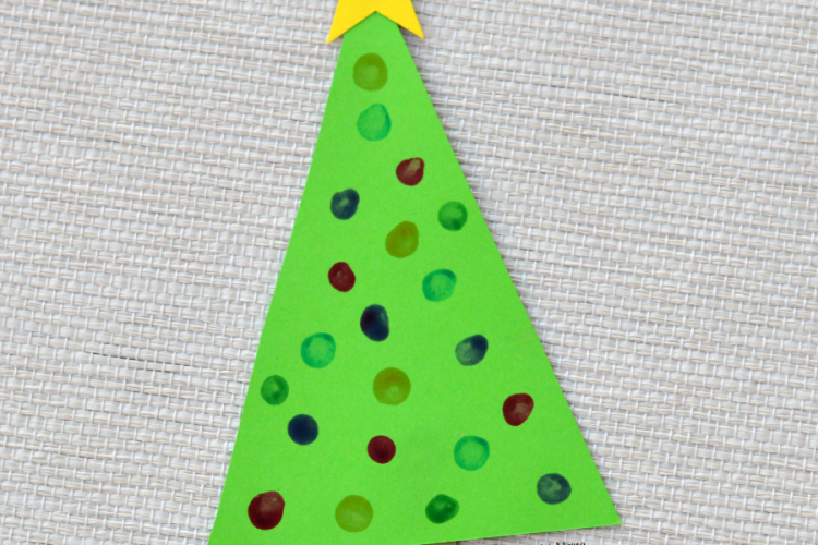 This Christmas tree craft is an easy low prep craft that kids can do independently and then turn into an ornament for your Christmas tree or a decoration for your wall or board. q-tip painting