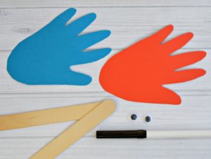 Cute handprint fish puppets inspired by Dr. Seuss One Fish Two Fish Red Fish Blue Fish. kid craft | book inspired craft | book extension activity