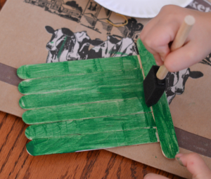 Leprechaun hat craft kids can make for St. Patrick's Day from craft sticks.