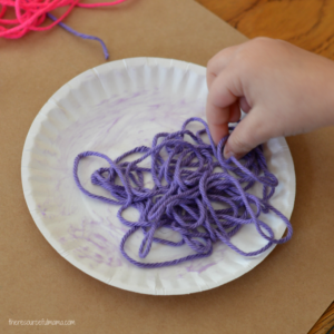 Use yarn to add texture and dimension to your flower craft. This is a great craft for kids to do in the spring, summer, or while studying flowers.