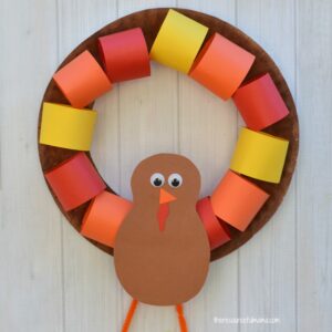 This Paper Plate Turkey Wreath is a fun kid craft and decoration for Thanksgiving.