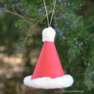 This Paper Santa Hat Christmas Ornament is an  inexpensive and easy craft that kids can make and hang on your Christmas tree and enjoy for years to come. 3D ornament