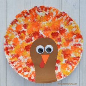 This Thanksgiving Turkey Craft uses a fun sponge painting technique on paper plates for the turkey's feathers that kids will love. 