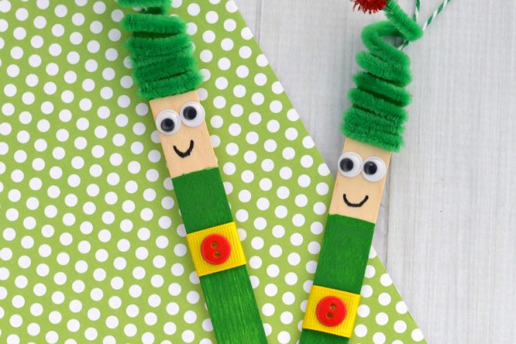 Kids will love creating this fun craft stick elf ornament from a craft stick and pipe cleaner to hang on the Christmas tree.
