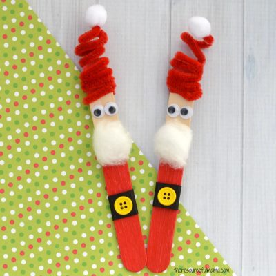 The whimsy pipe cleaner hat on this Craft Stick Santa Ornament is so fun! Kids will love to make this Santa ornament and hang it on the Christmas tree
