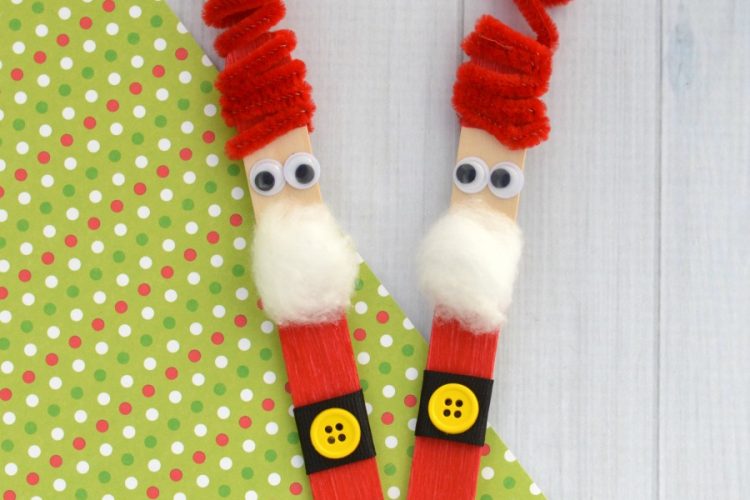 The whimsy pipe cleaner hat on this Craft Stick Santa Ornament is so fun! Kids will love to make this Santa ornament and hang it on the Christmas tree