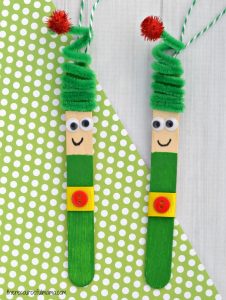 Kids will love creating this fun craft stick elf ornament from a craft stick and pipe cleaner to hang on the Christmas tree.