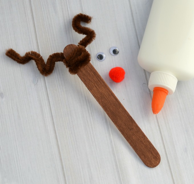 This Craft Stick Reindeer Ornament is a cute and easy Rudolph inspired ornament kids can make to hang on the Christmas tree. 