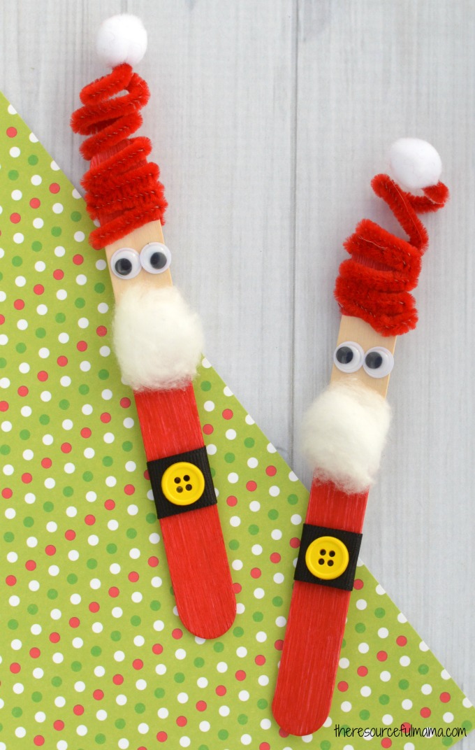 The whimsy pipe cleaner hat on this Craft Stick Santa Ornament is so fun! Kids will love to make this Santa ornament and hang it on the Christmas tree