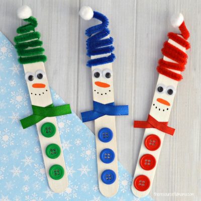 This Craft Stick Snowman with a fun spiral pipe cleaner hat is a really cute craft kids can make this winter and looks lovely hanging from the Christmas tree.
