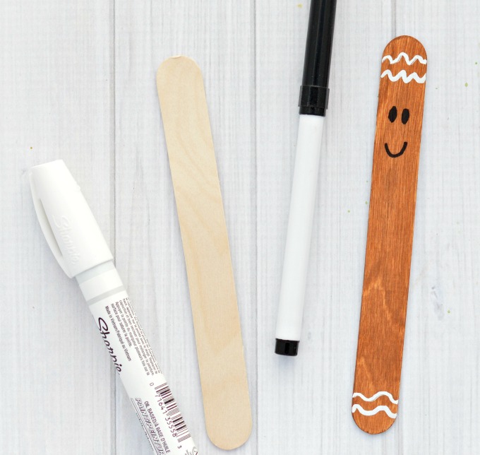 Transform basic craft sticks into this super cute gingerbread man ornament for your Christmas tree. 