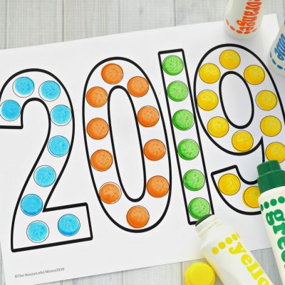 This dot painting activity is a great activity for young kids to ring in the New Year. It's also a fun way to teach young kids the new year.  