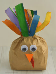 Turn your brown paper lunch bags into a plump and playful stuffed paper bag turkey craft for kids this Thanksgiving. This easy, inexpensive craft is quick and easy to put together with items you likely have on hand. They make a cute homemade decoration for your Thanksgiving table. 